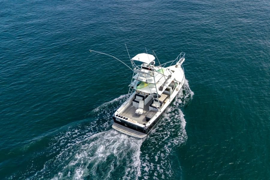 Guanatuna under way, seen from above, with her full shade canopy over the main deck