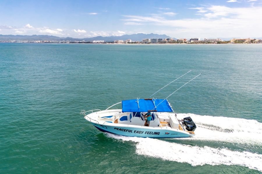 The shaded center console and open bow of Peaceful Easy Feeling