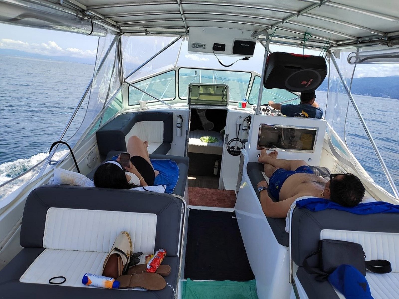 The shaded, cushioned deck of Guanatuna set up for a beach day