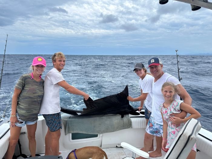 A family with their sailfish before the release