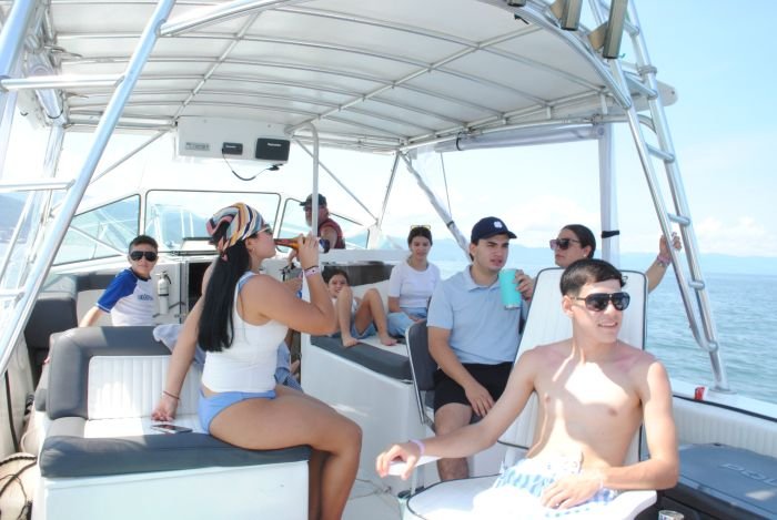 A family group cruising Banderas Bay under the shade