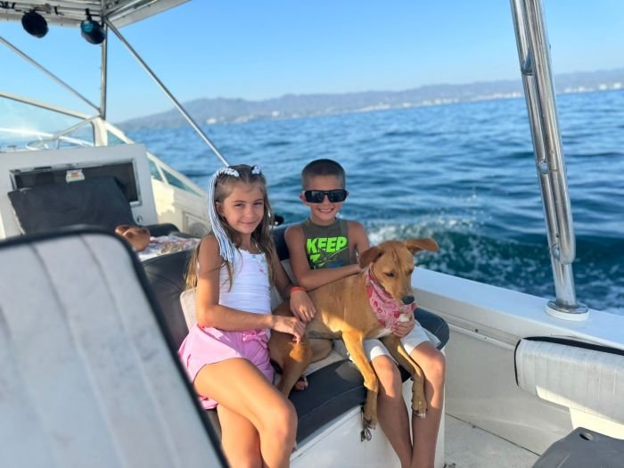 Kids (and the boat dog) along for the ride