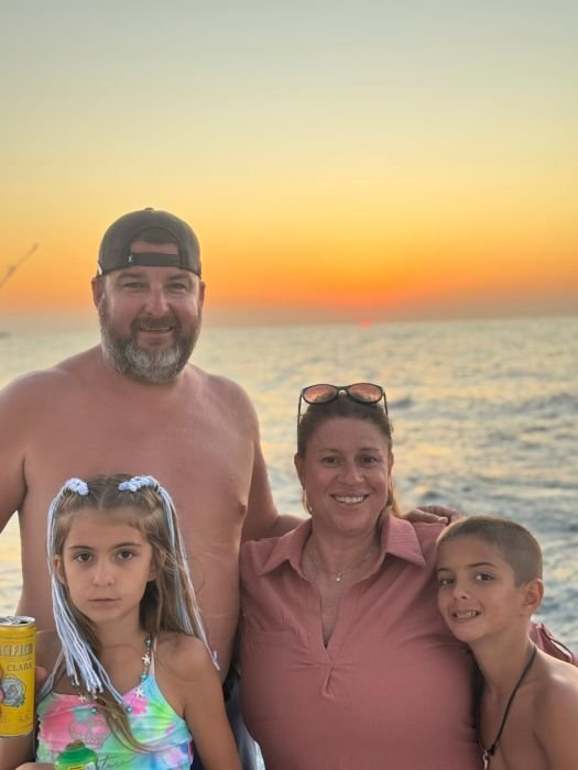 A family at sunset on the way back to the marina